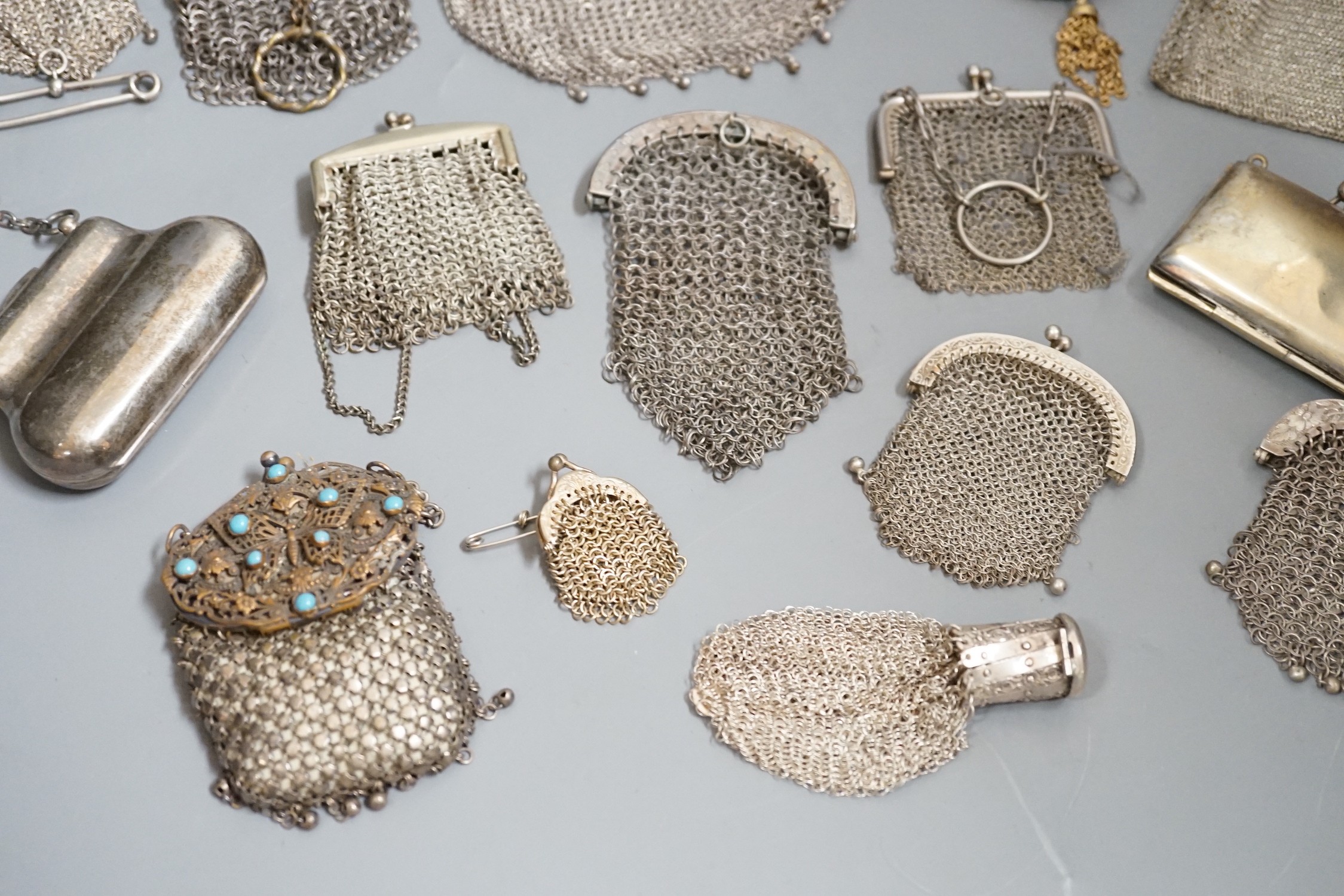 A stamped silver purse, together with eighteen metal chain mail purses and evening bags of various size, thickness and design